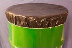 brown drum cover on green oil drum