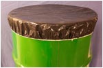 brown drum cover on green oil drum