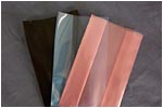3 colors of VCI transparent polyethylene film in Green, Blue, and Pink Tint made into pouches
